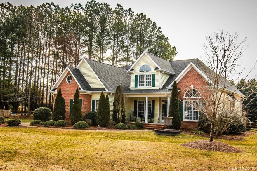 Dramatic story and a half situated on nearly one acre cul de sac lot!  Covered front porch for your rocking chairs and screened back porch overlooking a serene, fenced back yard.  Cathedral ceilings in the Great Room, dining room and master bedroom.  Brand new roof, hardwood floors just refinished.  Dedicated office. Upstairs computer niche, two bedrooms plus a large Bonus room.  Storage areas off of the Bonus room.  Well landscaped grounds, stone patio and built in gas grill.  Neutral decor