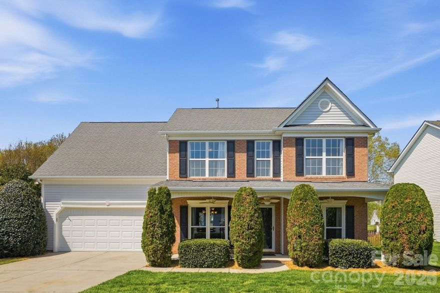 Wow—this stunning waterfront home with a rare double primary suite layout offers exceptional flexibility for multi-generational living and is nestled in one of the area’s most sought-after communities, known for its beautiful tree-lined streets and resort-style amenities.

From the moment you arrive, the home’s inviting curb appeal and expansive covered front porch—complete with ceiling fans—set the tone for comfort and charm. Inside, you’re welcomed by two versatile flex spaces at the front of the home, ideal for a home office, music room, reading lounge, or sitting area, perfectly positioned across from the formal dining room.

The spacious family room features a cozy fireplace and flows into the kitchen and breakfast area, creating an open layout perfect for both everyday living and entertaining. Large windows showcase breathtaking views of the backyard oasis, bringing in natural light and serene water views.

The main-level primary suite is generously sized and features a tray ceiling along with an updated en-suite bath, complete with a double vanity, large walk-in shower, and linen closet. Upstairs, a second primary suite with a private full bathroom provides an ideal setup for guests or extended family. You’ll also find two additional bedrooms and an oversized fifth bedroom or bonus room—perfect for a media room, playroom, or fitness space.

Step outside to your private backyard retreat, where an extended patio with a retractable awning invites you to relax or entertain while enjoying peaceful views of the pond and its elegant fountain—a truly rare and tranquil setting.

This exceptional community enhances your lifestyle with multiple stocked ponds, a community pool, park, and ball courts—all surrounded by picturesque scenery.

Conveniently located in Indian Trail in Union County, this home offers easy access to shopping, dining, and easy access to both the Monroe Bypass and I485, combining peaceful living with everyday convenience.