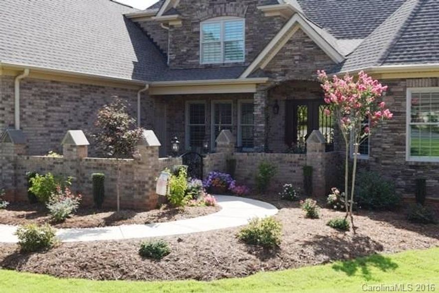 WOW! Stunning craftsman home at its finest! Feel the ambiance of this custom built by OZ, upgraded to the fullest w/ unique lighting, centerpiece fireplaces, many architectural details thru-out the home! Master on main w/coffered ceiling & immaculate master bath! Granite kitchen w/work island & farmers sink, stainless appls! Home features a gorgeous sunroom w/ FP, 2nd kitchen in laundry room w/ sink, & mudroom.  Front courtyard, Trex deck & much, much more! *See attachment list of upgrades.