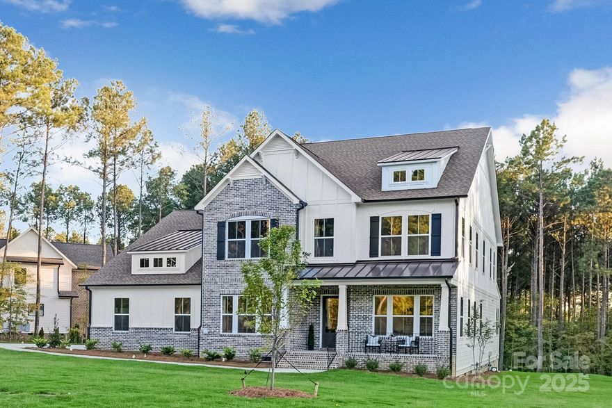 Experience refined living in The Atkinson, a high-end semi-custom home offering over 4,100 sq. ft. of exceptional design and upgraded features. This quick move-in residence showcases a private study and elegant beamed ceilings throughout the foyer, great room, and primary suite. The main level includes a guest bedroom and a luxurious primary suite with a 42” gas fireplace, spa-inspired bath with a freestanding tub, luxury shower, and dual walk-in closets. The great room features a striking fireplace and 12’ glass sliders opening to a covered rear porch. A gourmet kitchen shines with a porcelain farm sink, stainless steel appliances, double wall oven, 6-burner range, butler’s pantry, and expansive walk-in pantry. Upstairs offers four bedrooms, three full baths, a game room, unfinished bonus space, and utility room. Additional highlights include a 5-zone irrigation system, gas furnace, and side-load 2-car garage. Available now—a perfect opportunity for elevated living before the holidays!