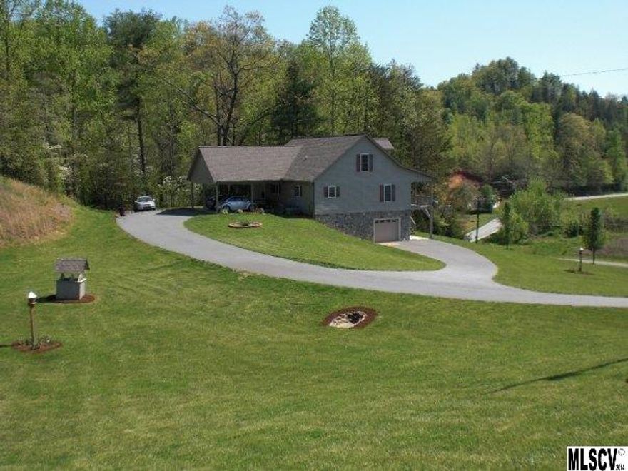 Stunning Mountain Views and Convenient Location make this the perfect home! Impeccably maintained and perched on more than 2 acres, only 15 minutes from Blowing Rock and a quick drive to shopping in Lenoir. You can enjoy the beautiful mountain views as well as privacy from a wrap around covered porch. Kitchen is updated with oak cabinets, eat in bar and stainless steel appliances featuring a gas range with convection oven and microwave. Dining area has French doors that open up to wonderful covered porch. Archway entry into den with gas log fireplace and wired for home entertainment. Master bedroom has 2 walk in closets and beautiful mountain views. Tiled Master bath has double sink vanity and whirlpool tub. Additional 3 bedrooms have an abundance of closet space and mountain views. Laundry on main. Unfinished basement has high ceilings and is plumbed and ready for a 3rd bath and additional living space. Property has underground dog fencing installed.