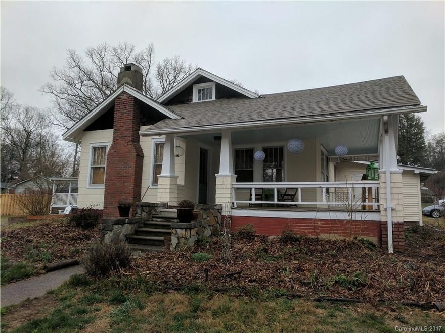Classic Black Mountain bungalow on a flat, sunny lot right in the heart of town! Easy walk to downtown with sidewalk right across the street. Hardwood floors, new exterior paint, newer gas furnace and roof, and huge kitchen. Addition on north side is plumbed but unfinished. It would make an ideal office or studio. Yard is perfect for gardening and pets. Attic space is finished but not counted in square footage (unheated, ceiling height below 7 ft). Corner lot.