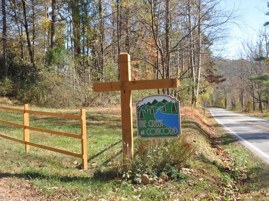 The Creek at Concord is a small community of three home sites situated in beautiful South Asheville, moments away from lively downtown Asheville. Gentle building site under a beautiful Magnolia Tree and one of three homes on private driveway. Great location for your dream home in highly desirable TC Roberson school district. 1500 Square feet required with approval of developer.
