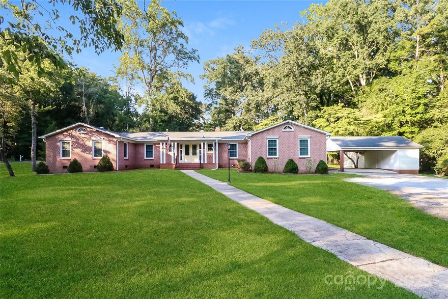 Charming 3-bedroom, 2.5-bath home featuring new carpet, beautiful flooring, and a cozy living room with a brick accent wall and fireplace. The country-style kitchen offers stainless appliances and plenty of character, making this home both inviting and move-in ready.