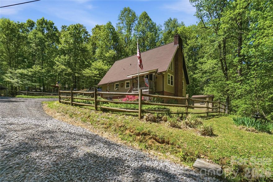 Tucked away on 4.36 private acres in Kannapolis, this distinctive A-frame home offers the kind of setting that feels like a mountain retreat while still keeping you close to Concord, I-85, shopping, and dining. This 3-bedroom, 2 full bath property combines rustic character with practical updates, including HVAC replaced in 2018, roof replaced in 2019, water softener installed, plus no city taxes! Inside, the home is full of warmth and personality. The dramatic vaulted great room features soaring ceilings, a striking wall of windows, and a beautiful stone fireplace with cast iron insert stove that anchors the space and enhances the cozy lodge-like feel. The kitchen offers abundant cabinetry, updated appliances, and a functional eat-in arrangement, while the loft-style upper level overlooks the main living area and adds to the home’s classic A-frame charm. Outside, the setting is what truly makes this property special. From the inviting front porch to the expansive rear deck and pergola-covered outdoor living area, the home is surrounded by mature trees, peaceful views, and a sense of privacy that is hard to find this close to town. Fenced garden and yard areas, a storage shed, and thoughtfully designed outdoor spaces make it easy to enjoy the land in a variety of ways. Washer, dryer, and all appliances remain, making this one even more move-in ready. If you have been looking for something with character, privacy, and a true getaway feel without giving up convenience, this one checks all the boxes!
