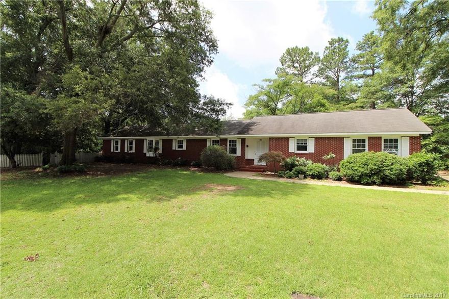 Nice, Brick Ranch Style Home with 4 Bedrooms & 2 Baths located on approximately 0.65 Acre in Town of Clover. Split Bedroom Plan. Approximately 2333 heated sq. ft. Formal Dining Room, Sunroom and Breakfast Area. Kitchen features white cabinets, corian counter tops & tile flooring.  All bedrooms have hardwood flooring 1 + Car Attached Garage Detached Storage Building. HVAC System was installed 7/2015.