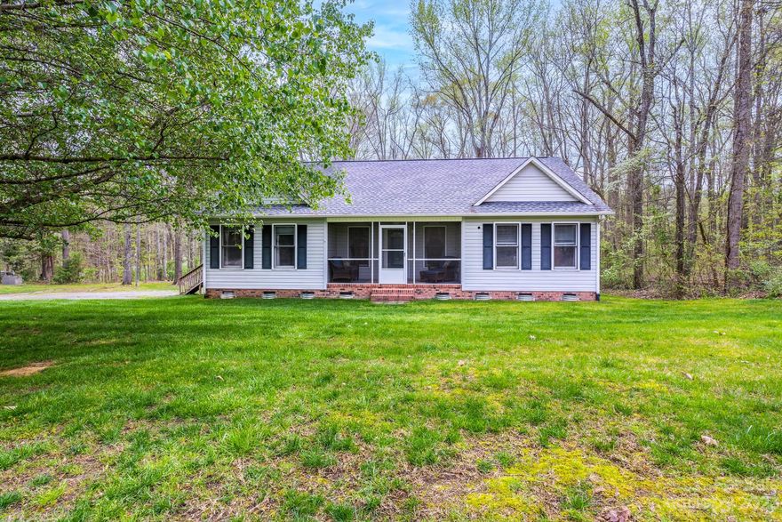 Welcome to country living, but just minutes from everything!  Adorable ranch on a private, wooded large corner lot, inside a quiet neighborhood, just a short drive from I-77. Did I mention private?! Perfect starter home or retirement home featuring a split bedroom floor plan. Family room has vaulted ceiling with a fireplace that opens to the kitchen & eating area. Luxury Vinyl Tile flooring runs throughout the home. Crawlspace has been completely encapsulated with a dehumidifier.  A covered screened front porch and large private back deck allow for plenty of outdoor living as well. There's even a wired storage building for the DIY projects. Don't miss seeing this one!