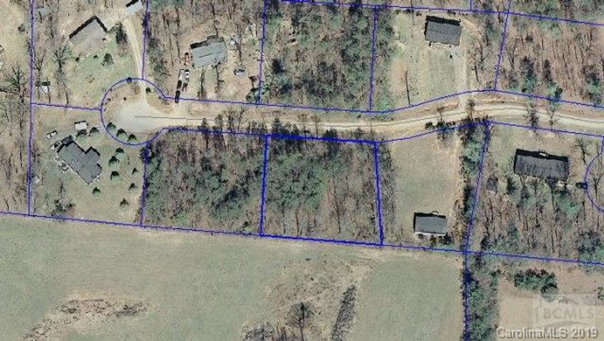 OWNER WILL FINANCE!!! Wooded 0.585 acre lot suitable for doublewides,single wides or modulars!!! Water tap at road...septic needed.Priced at $6,900. Lot #6 also available see MLS #22620.