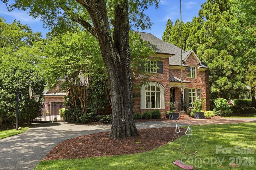 Highly desirable Myers Park's tree-lined street! This stunning brick two story traditional home is gorgeous inside and out. Hardwood floors throughout, high ceilings, crown moldings, and so much attention to detail. Welcoming foyer, traditional Dining room, Sitting room with custom built-ins. Family Room with gas fireplace opens to screened porch with EZ Breeze windows. Kitchen with Subzero fridge, Wolf double ovens, breakfast area, bar for entertaining, and renovated laundry with utility sink,  custom cabinets, and side entry. Guest suite with full bath and walk in closet on main, currently being used as Den. Upper level with hardwoods throughout. Huge Primary suite and gorgeous updated bath. Marble floors, Separate vanities w/ soapstone counters, soaking tub, standing shower and walk in closet. Three additional bedrooms on upper level and two full baths. Two car detached garage with new door, epoxy floor and slat storage system. Private entrance to Second level Bonus/bedroom with built in-shelves, full bath, and walk in closet. Gorgeous manicured yard with turf and blue stone terrace. Circular drive, Newly Fenced back yard with private electric gate.