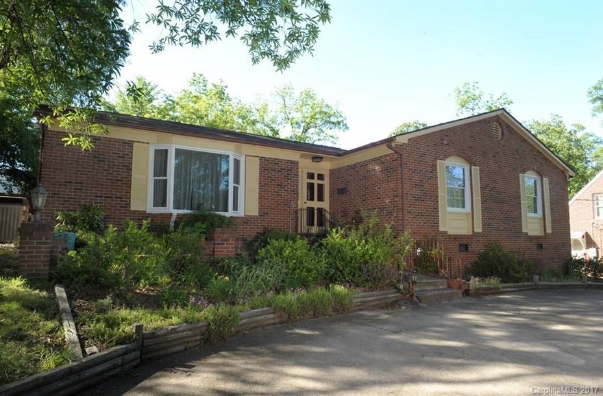 Charming three bedroom brick home. Kitchen with appliances, living room, and den with fireplace. Sunroom overlooking back yard. Home to be sold "AS IS".