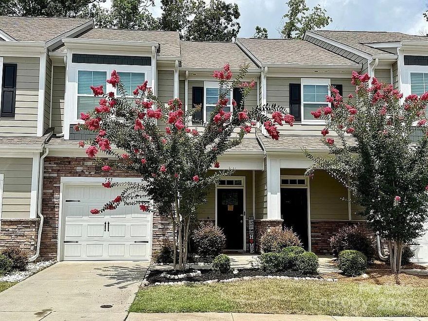 Discover modern elegance and cozy charm in this 3-bedroom, 2.5-bath townhome in Ivy Ridge. On a quiet cul-de-sac, it offers peace in a vibrant neighborhood. Built in 2020 and upgraded, it features style, function, and low-maintenance living.Enter the open-concept main level: custom fireplace in living room with cabinetry and shelving for relaxation or display; dining area with updated light fixture; half bath with new vanity and trendy wallpaper.Upstairs: three bedrooms including spacious primary suite. Contemporary vibe throughout.Community amenities: clubhouse, pool, pickleball court. Easy access to shops, dining, and Clover schools. Gateway to effortless living. Don't miss it!