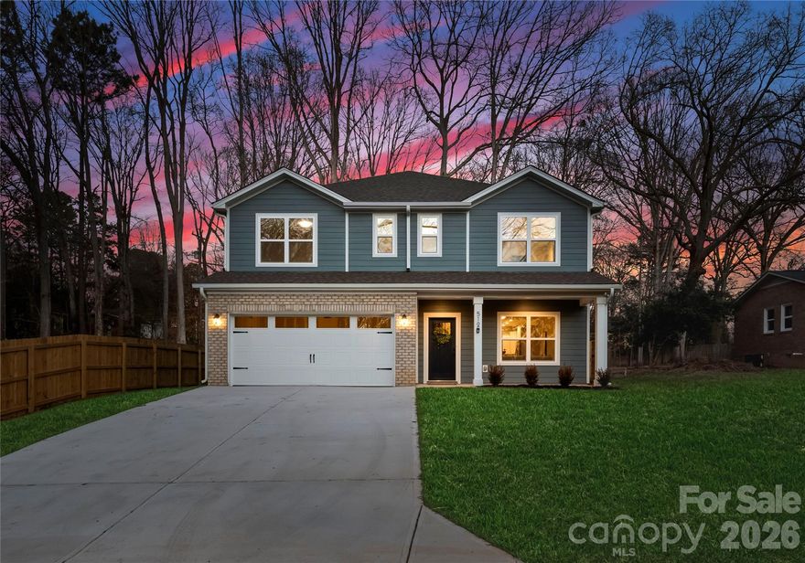This beautifully designed five-bedroom new construction home is set within the charm of downtown Waxhaw, surrounded by mature trees and a private fenced in backyard. Thoughtfully crafted to balance style and functionality, the home features open-concept living areas ideal for both entertaining and everyday comfort. A main-level guest suite offers added flexibility, while the kitchen showcases quartz countertops, soft-close cabinetry, a spacious island, and ample workspace. Upstairs, the expansive primary suite serves as a private retreat with a spa-inspired bathroom and generous closet space, complemented by well-sized secondary bedrooms. This home provides easy access to local shops, dining, and community amenities. See directions, GPS currently not correct: From W South Main St, turn onto S Broad St, R onto Givens (briefly turns into Anne,) R onto Lynn St, L onto Anne Avenue. Home will be on left. Images may depict a similar home and not the actual property.