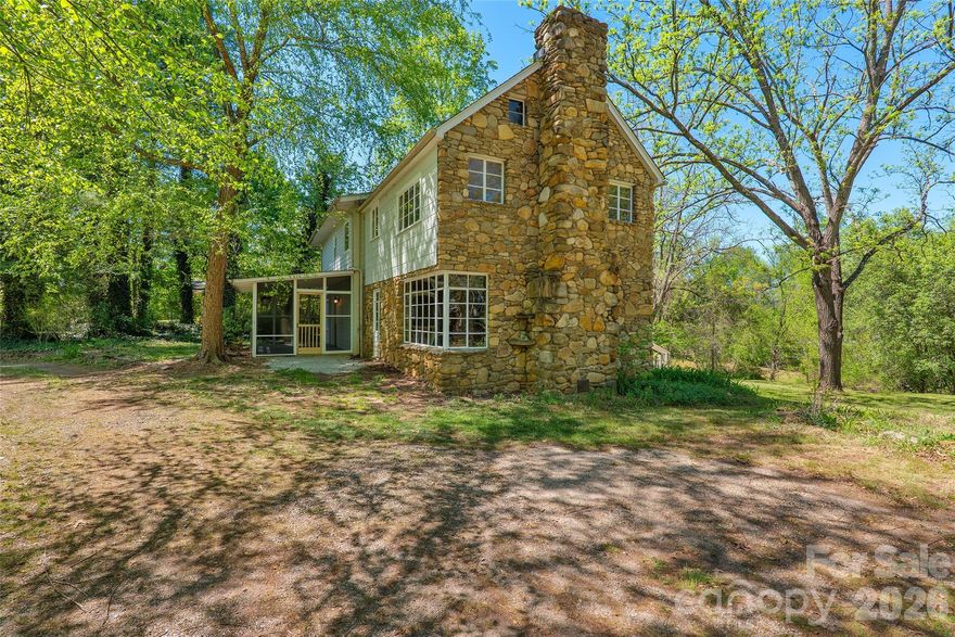 Tucked serenely off the road on 1.48 bucolic acres, this renovated 3-bedroom, 1.5-bath farmhouse delivers vintage appeal, seclusion and space without forfeiting modern comforts. A sleek, inviting  eat-in kitchen, recently remodeled and never used, is ready for the smells of fresh morning coffee and dinner gatherings. Need more guest space? Host your housewarming party in the adjacent dining area by a classic fireplace mantle or retreat to the irresistibly rustic stone walled living room anchored by a second quintessential fireplace that welcomes with timeless character. Up a wide wood staircase reminiscent of a different era you'll find three very generous, airy bedrooms, with lots of useful closet space, a well-appointed full bath and an easy access attic for additional storage. The main floor laundry, 1/2 bath and mud room round out a floor plan that's as practical as it is charming.The  expansive parcel provides mature landscaping, sunny privacy, and breathing room in every direction. It will readily support multi-vehicle parking and project areas, outbuildings, micro-farming, chickens? - this is the place to start the homestead you've been dreaming of so come create your life on a property that echoes with history and offers promises for the future before someone else makes it their own!