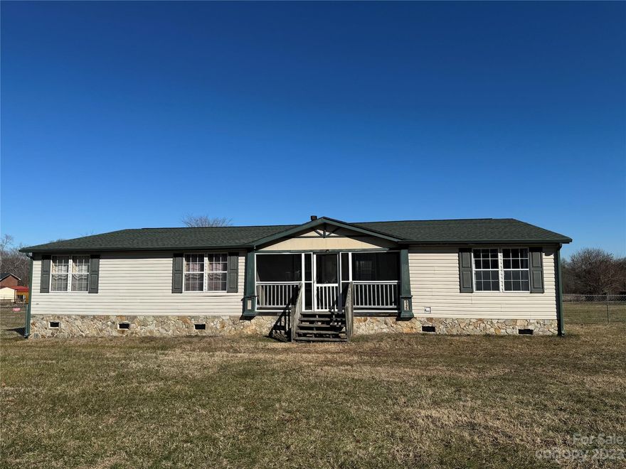 This 4-bedroom, 2-bathroom home is nestled in a serene town, offering a peaceful retreat on an expansive acre of land. The spacious living room provides a seamless connection to the kitchen, creating a large open floor plan. The primary bedroom boasts a generous size, complemented by a substantial walk-in closet and French doors leading to additional room that would be excellent for a home office. While the property requires some tender loving care (TLC), the potential for a stunning transformation is evident with the application of the right touches. This home holds the promise of becoming a delightful and inviting with the right enhancements.