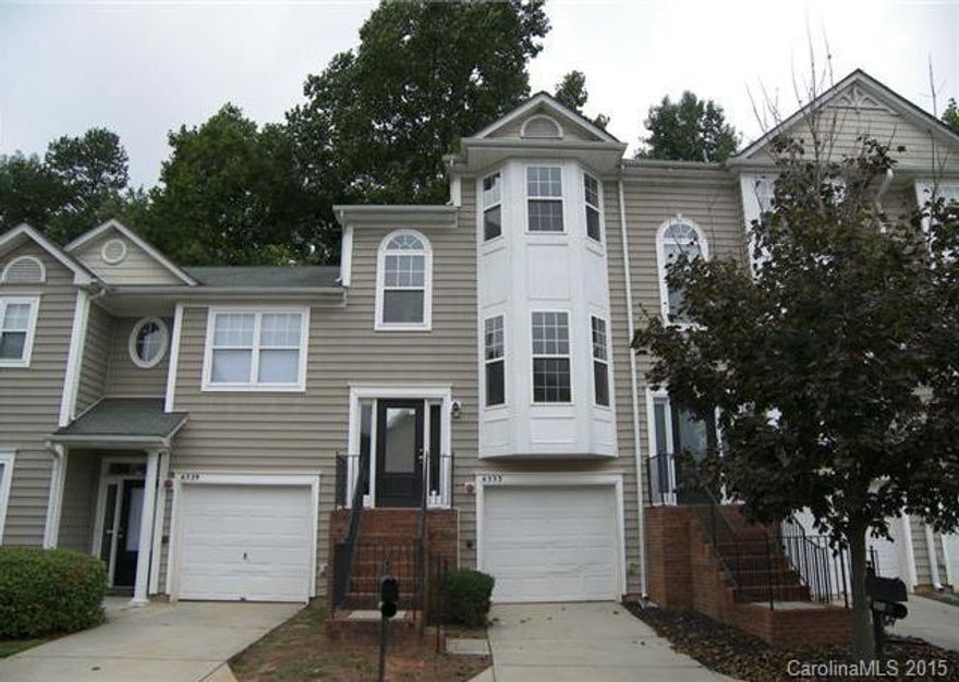 The owner is installing granite counter top in kitchen, tile back splash, fridge, and washer and dryer