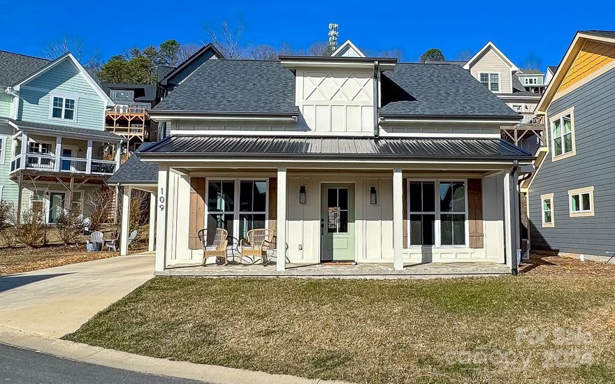 Like NEW home WALKABLE to downtown Black Mountain and mountain VIEWS. Custom built ranch home lived in less than 2 years with high quality workmanship, designer finishes with 2 bedrooms & 2 full baths.  The owners en suite has 2 sinks with lots of storage & a large shower. Home has an open floor plan with a huge living, dining, & kitchen area, perfect for entertaining and large gatherings. Granite counters in kitchen & baths, high end LVP flooring, designer lighting, gas fireplace, 2 covered porches in the welcoming and quiet Tudor Croft community.  Tons of natural light, great views, near Lake Tomahawk and only 10 miles to Asheville. The Tudor Croft neighborhood offers low-maintenance yards and minimal HOA fees (just $15/month), amazing views, underground utilities, including natural gas, fiber 1g internet available.