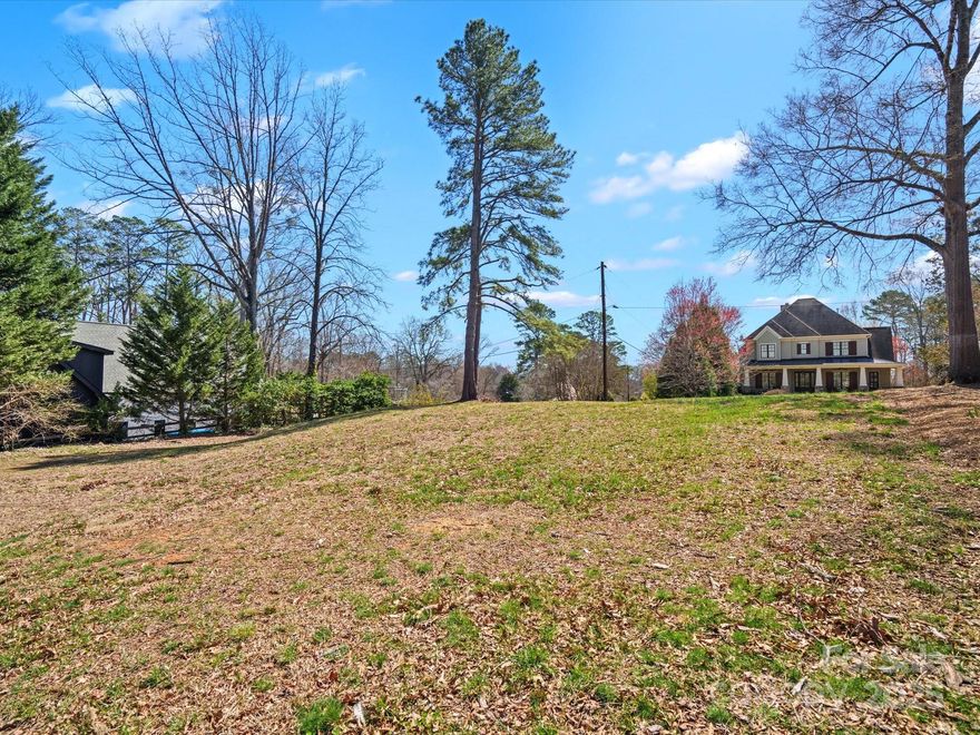 An exceptional opportunity awaits in the heart of Myers Park, one of Charlotte’s most prestigious neighborhoods. This rare, cleared, large lot is situated on a picturesque, tree-lined street directly across from the iconic Freedom Park, offering the perfect blend of tranquility and convenience.  With a large footprint, this lot presents the ideal canvas for your custom dream home. Enjoy an unparalleled lifestyle just steps from the scenic trails, playgrounds, and green spaces of Freedom Park, while being minutes from the vibrant energy of Uptown Charlotte, historic Dilworth, and the city's finest shopping and dining. Don’t miss this chance to secure a prime piece of real estate in one of Charlotte’s most sought-after locations. Opportunities like this are rare—bring your vision and make it a reality!