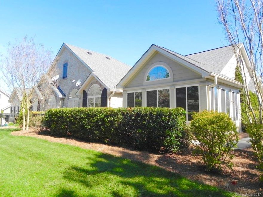 Mt. Island Lake's Premier Gated Community w/ great amenities - pool, fitness center, social events and more! Sunroom & Patio overlooks private natural area. Home has all tile and bamboo floors. Walk-in-Closets in both Bdrms. Skylights, Lndry Rm w/cabs leading to Study. HOA dues inc: lawn care, water, sewer, trash, & HO insurance.   Large kitchen w/ lots of counter/cabinet space.  Oversized 2 car garage & pull down attic for storage.  Home is freshly painted & is in excellent shape.