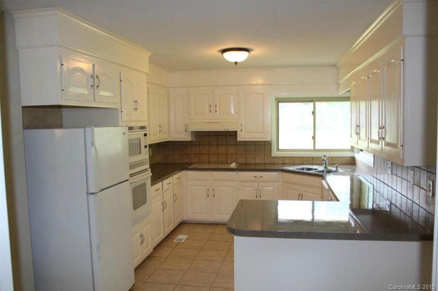 Just putting final touches on remodeling this lovely home.  Very spacious and open floor plan.  Added 3rd full bath, all new paint, refinished hardwoods, new carpet. Very large bedrooms and nice size kitchen.  Lots of natural light.  The driveway is shared with two other homes.  There is a view of water just down the driveway.  Nice flat lot with trees on side.  Owner is Broker.