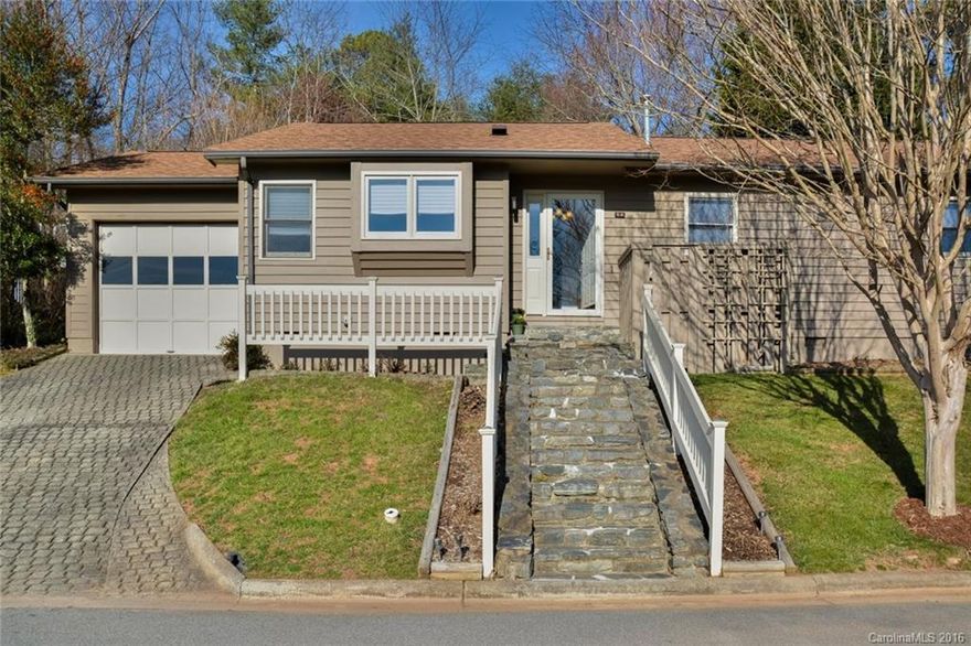 ADORABLE! AFFORDABLE! ACCESSIBLE!! Here it is, a sweet low-maintenance home only 5 minutes to downtown Asheville, with gorgeous views and grounds, kind neighbors, and a wonderful setting.  Peaceful and quiet with a private back yard and expansive community space in the front.  Unheated sun room makes an incredible addition to the livability of this home.  Soaring ceilings, updated kitchen, and plenty of storage are a joy to come home to.  Easy living in Haw Creek....it doesn't get much better!