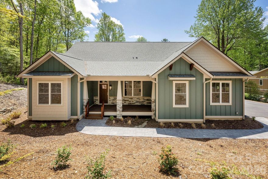 Rare, one-level new construction home offered atop Kenmure at nearly 3,000 feet elevation. Craftsman styled home with 2,588 square feet all on one level. This home is under construction and should be ready for occupancy on or around 04/15/2026 ...  Features open floorplan consisting of 3 Bedrooms / 2.5 Baths. The custom built kitchen will be equipped with GE stainless steel appliances, granite countertops, and plenty of storage. Also on the main floor you'll find the luxurious master suite, complete with a walk-in closet and a spa-like ensuite bathroom with a walk-in tiled shower + dual vanity sinks. Additional features include a Large 2-car garage + a spacious covered screened porch for a great place to relax and enjoy the beautiful mountain views. Stone fireplace in the great room and site - finished wood floors throughout the home. Welcome to your dream home in Flat Rock.  50% off Kenmure Membership Initiation Fee!