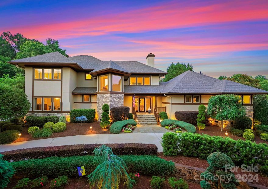 Step into the timeless elegance of this Frank Lloyd Wright Prairie style home, where modern luxury meets classic design. Bathed in natural light, this architectural gem offers an open floor plan with breathtaking views from every window. Beveled glass doors and custom finishes add a touch of sophistication. Enjoy a sun-drenched interior that enhances the beauty of each room. Featuring a limestone-surrounded gas fireplace and grand windows. Kitchen equipped with high-end appliances and thoughtful design. Indulge in the master bath with a unique shower cave, and a relaxing tub. Tranquil space overlooking the pool, perfect for reading or quiet reflection. A spacious walk-in attic above the three-car garage. Outdoor paradise featuring a pool, a waterfall, a convenient bath, and complete privacy. Take a walk down the tree-lined streets and hop on the local Westbranch greenway or enjoy a bike ride on the paved way to downtown Davidson. Enjoy everything River Run and Davidson has to offer.