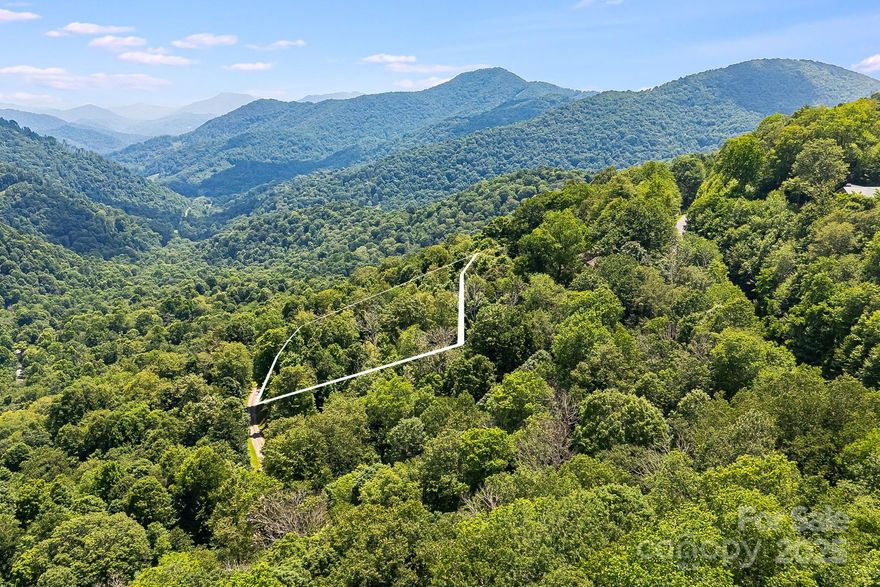 Find your sanctuary on Lot #16 in The Preserve at Wolf Laurel. At nearly 4,000 feet this 1.73-acre homesite offers cool summer temperatures and panoramic views of the Bald Mountains. The gated Preserve is bordered by conservation land with miles of hiking and ATV trails and offers quick access to the Appalachian Trail and ski slopes. Residents may join Wolf Laurel Country Club, an 18-hole course rising from 3,600 to nearly 4,800 feet—one of the highest east of the Mississippi—and enjoy fine dining and a friendly membership. The club also features a 24/7 fitness center with strength and cardio equipment, group classes and a yoga pavilion. Optional Village Club membership adds a heated pool, tennis, pickleball, multi-sport courts, trout pond and playgrounds. Social events foster friendships. Burnsville is about 20 minutes away and Asheville roughly 45 minutes. Within the gates enjoy a stocked trout pond and 50 miles of trails. Build your dream retreat in this special mountain community.