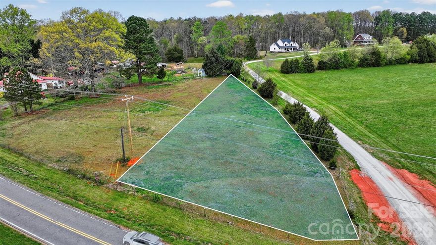 This beautiful 0.51-acre lot in Maiden, NC (Catawba County) sits on E. Maiden Rd beside 3778 E. Maiden Rd—this is what the buyers are chasing right now. Zoned R-40, this parcel gives you the space, freedom, and flexibility most buyers can’t find anymore. Think NO HOA, NO restrictions, and gentle topography—which means easier building and more control over your design, this land gives you options.  The property balances privacy with convenience. Explore the lot and plan your project. Well and septic will be needed. Buyer to verify zoning, utilities, and build requirements.  Bring your builder. Walk the lot. Start planning.

PLEASE DO NOT PARK IN DRIVEWAY NEXT TO THE PROPERTY!  THIS IS A PRIVATE DRIVEWAY!
WE WILL GET YOU ACCESS THROUGH THE PROPERTY AT 3778 E. MAIDEN RD.