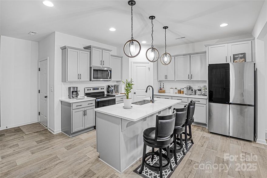 This home qualifies for $20,000 in lender assistance for closing, down payment, and rate buydown! Move-in-ready townhome built in 2022, offering 3 bedrooms, 2.5 baths, and 1,792 sq. ft. of thoughtfully designed living space. The open-concept main level features a modern kitchen with quartz countertops and stainless steel appliances. Upstairs, the primary suite includes a tiled walk-in shower, while the additional bedrooms offer flexibility for guests or a home office. A second-floor laundry room provides added convenience. Enjoy privacy with a fenced-in patio and 1-car garage. Located just minutes from shopping, dining, major highways, and local favorites such as the U.S. National Whitewater Center.