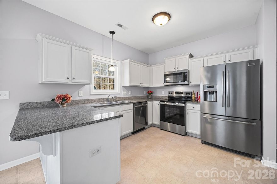 Welcome to this move-in ready Fort Mill home with NO HOA, a fenced backyard, and an unbeatable location near Downtown Fort Mill, Indian Land, Ballantyne, and Anne Springs Close Greenway! This beautifully maintained 3-bedroom, 2.5-bathroom single-family home with a one-car garage offers the perfect combination of comfort, convenience, and flexibility in one of the Charlotte area’s most desirable locations. Step inside to discover an inviting layout with 9-foot ceilings, abundant natural light, and stylish finishes throughout. The living room creates the ideal setting for relaxing evenings, entertaining guests, or everyday living. The kitchen is designed with both function and style in mind, featuring granite countertops, a breakfast bar, ample cabinet space, and updated stainless appliances including a new oven and microwave (2025) plus dishwasher (2023). Upstairs, the oversized primary suite offers a peaceful retreat with vaulted ceilings, a private en-suite bathroom, and generous closet space. Two additional bedrooms provide flexibility for guest rooms, a home office, fitness space, or growing household needs. Enjoy outdoor living year-round in the fully fenced backyard — perfect for pets, cookouts, gardening, or quiet evenings under the stars. With NO HOA restrictions, you’ll enjoy added freedom rarely found in this highly sought-after Fort Mill location. Conveniently located just minutes from shopping, dining, entertainment, parks, and top commuter routes, this home is also only 15 minutes from The Bowl at Ballantyne and close to the outdoor recreation, trails, and events at Anne Springs Close Greenway. If you’re searching for a home in Fort Mill with no HOA, granite countertops, updated appliances, fenced yard, and easy access to Ballantyne and Indian Land, this home is a must-see.