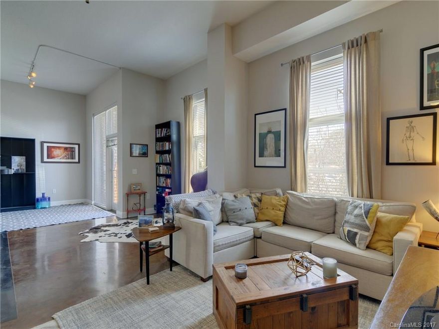 Very unique and large 1 bedroom in Dilworth's best condo building.  Stained Concrete floors, 12 ft ceilings, brand new stainless appliances, freshly painted home.  Building is concrete and steel construction with secure entrance and lot of secure entrance parking.  Walkable to restaurants, grocery stores, shops, Freedom park and just minutes to uptown.  Building has fitness center, roof top terrace and private, landscaped courtyard.