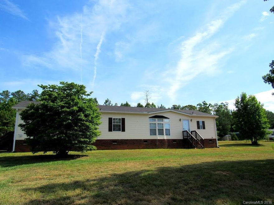 Well maintained doublewide on 2 acres in Catawba. Almost 2000 sq ft under roof. 3 Bedrooms, 2 full baths, big kitchen w/work island, 2 living areas, fireplace, private rear deck for great entertaining.
