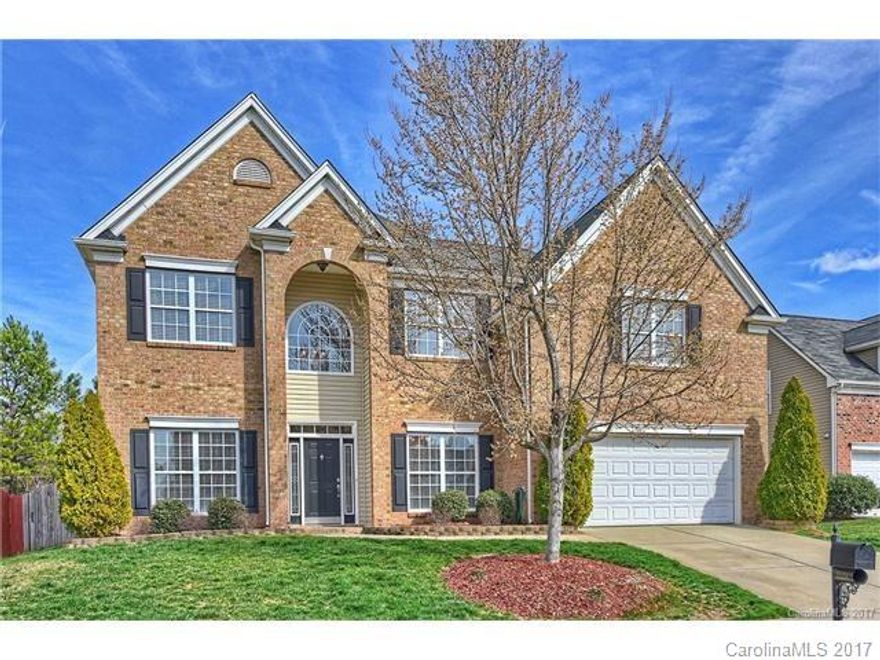 This home boasts 5 bedrooms plus a main floor home office, a media/rec. room, high ceilings, open floorplan and a large, fenced yard. The kitchen has large tile floors, 42" cherry cabinets with granite countertops, stainless appliances, tile backsplash and walk-in pantry. Kitchen opens into a large family room with gas fireplace and built-ins and gorgeous hardwood floors. Neighborhood has community pool/clubhouse, playground and walking trails.