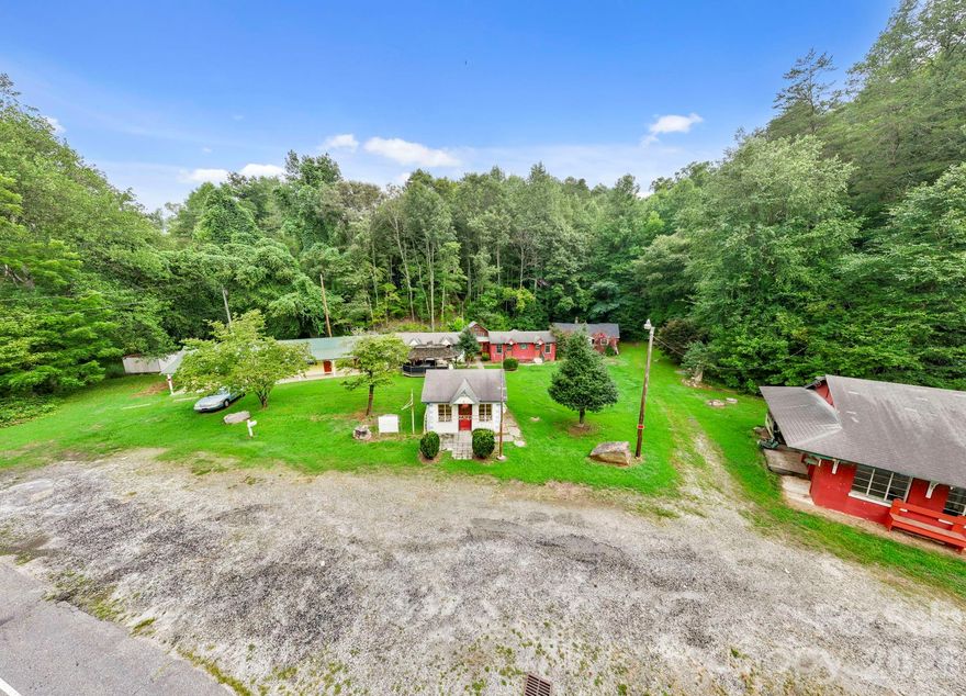 Don't let this opportunity to own your own business in Lake Lure pass you by. The possibilities are endless with this 4 acre property that features 6 versatile buildings with mixed used potential. Great for investors, developers, and business owners. Several buildings have been used for motel/short term rental, while others offer unique potential, including one that was formerly operated as an ice cream shop and another as an antique store. Bring your creativity and turn this well-located property into your next business venture.