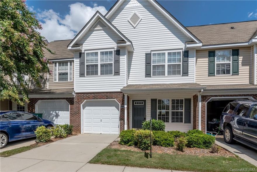 NEW carpet & paint in this open floor plan, extra spacious 2 bed townhome w/garage. 2-story great rm w/gas log fireplace. Formal dining & living rooms w/pass thru from kitchen. Kitchen features upgraded black appliances (inc fridge) & new floors w/french doors to patio. Patio & lawn area back to natural setting. Upstairs has 2 spacious bedrooms & a bonus loft area.  Master suite has walk-in closet & private en suite bath w/dual sink vanity & garden tub/shower combination. 2" blinds throughout.