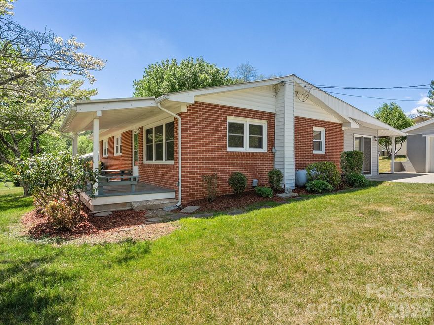 Step into this charming ranch-style home for sale right in the heart of Waynesville city limits, where everyday convenience meets comfortable country living. Nestled on a beautiful corner level lot with easy access to everything town has to offer, this three-bedroom, two-bath gem features public utilities for hassle-free ownership with a freshly updated metal roof, Insulated vinyl windows throughout flood the interior with natural light while keeping heating and cooling costs low. Out front, a welcoming covered porch while the spacious rear covered porch is perfect for morning coffee or evening grilling sessions overlooking the yard. Inside, the open living room flows effortlessly into a spacious kitchen area complete with plenty of room Adjacent is a cozy family room ideal for movie nights or relaxing plus a separate laundry room  Two full bathrooms ensure everyone has their space, with the primary offering a peaceful retreat. Outside, a detached double-car garage with a smooth concrete driveway provides secure parking and extra storage, and the level lot gives you room to roam or add your personal touches. Whether you’re a first-time buyer, downsizing, or just seeking that perfect one-level living ranch lifestyle in city location, this well-maintained home checks all the boxes—comfortable, practical, and ready for you to move right in and make it your own.