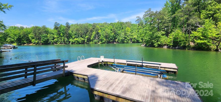 Premium wooded and gently rolling waterfront in Dry Creek community.  Take an easy walk to the water where you'll find a dock with boat lift.  Quiet cove is the perfect place to relax on a float on a hot summer day. 1.66 acres for your vacation or full time home.  Dry Creek has city water but you'll need to install a septic.  Underground utilities including fiber optic internet.  Community walking trails and pool/clubhouse.  Close to all the outdoor activities including Pisgah National Forest, Fonta Flora State  for biking, camping and hiking.  Enjoy the crystal clear waters of Lake James for boating, fishing, kayaking, wake boarding & surfing and water skiing. Just 15 minutes to the  vibrant town of Morganton for breweries, restaurants, shops and community activities.  Super convenient location midway between Asheville and Charlotte.