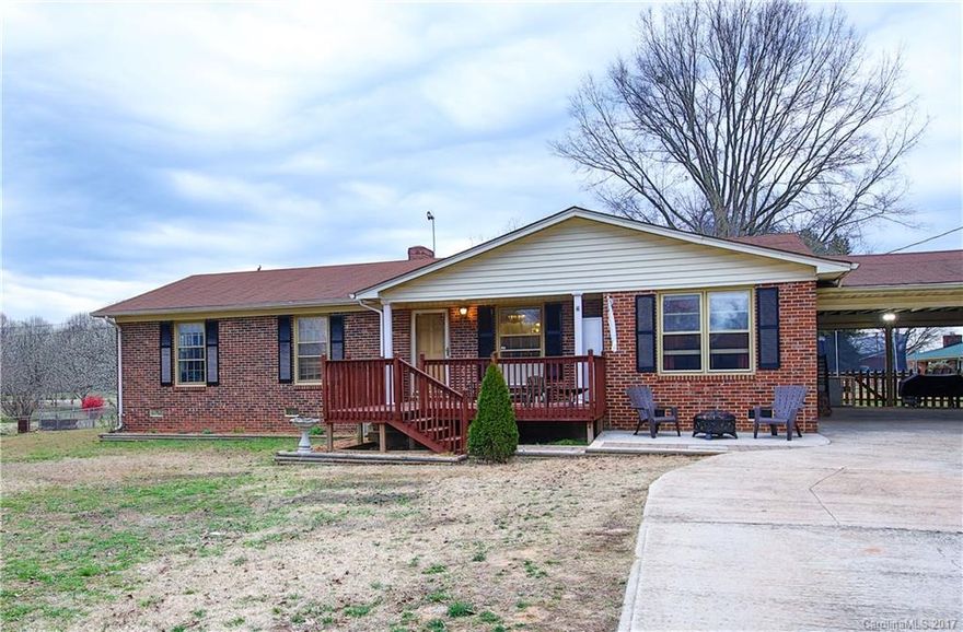 Nice brick ranch with 3 large bedrooms, 2 /12 baths.  Big eat in kitchen with cozy fireplace.  Lots of hardwood floors.  Rear deck overlooking a large fenced in yard; almost 1 acre.