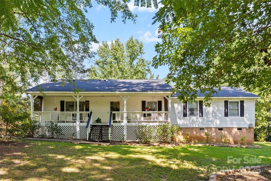 Situated on a spacious ¾-acre lot in the quiet Ridgewood Farms community, this charming ranch offers the perfect blend of comfort and convenience with no HOA. The home features three bedrooms and two full baths, along with a welcoming rocking chair front porch that sets the tone for relaxed living. A large sunroom, complete with its own Amana system for heating and cooling, provides additional living space to enjoy year-round. Outside, you’ll find three covered carport spaces (two paved), a back deck partially sheltered by the carport roof for entertaining, and a sizable shed offered as-is for extra storage. Located in the award-winning Clover School District, this property combines a peaceful neighborhood setting with easy access to Lake Wylie’s shopping, dining, and recreation. With larger lots and a friendly community feel, Ridgewood Farms is an ideal place to call home.