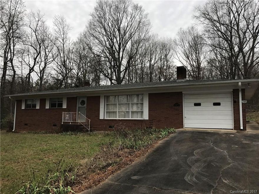 fantastic, conveniently located all brick home on 2.8 wooded Acres near Badin Lake, but super close to town. Hardwood floors through one level home. Pines in the front yard & hardwoods in the back. Lots of privacy. This home on this acreage in this desirable location.