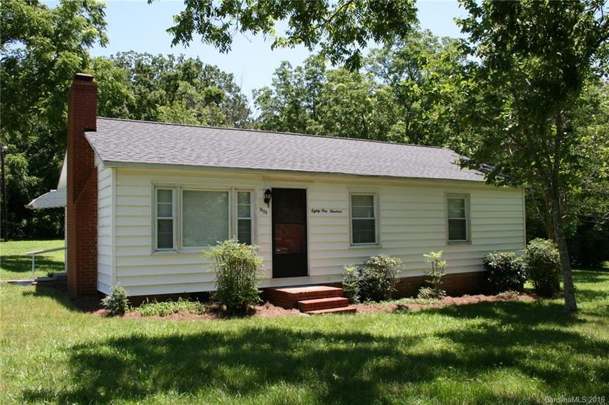 Ranch Home on over 2 Acres!  Living Room has prefinished hardwood flooring & wood-burning fireplace.  Kitchen with electric range/oven & plenty of cabinets & adjoining bright dining area.  2 Bedrooms.  Separate convenient space for office and laundry has lighted ceiling fan.  Outdoor storage building could be used as garage.  Also room for extra parking.