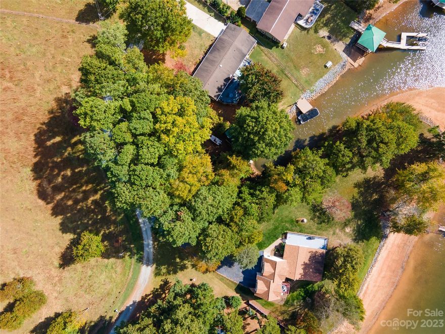 Great lot on small cove with beautiful view of Lake Norman. Private and quiet neighborhood along the water in charming Denver. Bring your own builder and build your dream home on your own waterfront lot. No HOA restrictions. At the moment, it is perfect for launching a canoe, kayak or paddle board. 
Unsure if this lot would be approved for a small dock, but buyer will have to check on this.
Sewer is available with tap fees of $3000 and development fee of $1600. Sewer may require a grinder pump. Please verify with Lincoln County Public Works.
A well will need to be installed for water.

Directions for GPS:  This lot is to the left of 7964 Shipps Lane , Denver, NC