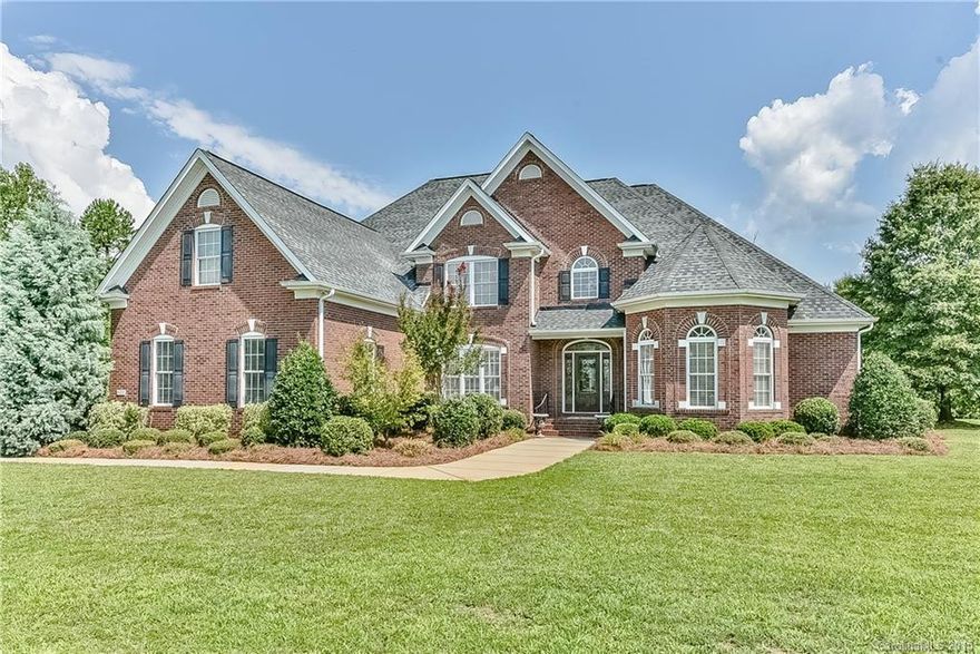Stately custom 4BR/3.5BA brick has it all. HW floors abound up & down, built-ins in vaulted great room, fireplace, large bonus room with built-ins & sink. Huge master down with whirlpool/separate shower, 2 walk-ins, granite, tile. Chefs kitchen with SS appliances, beautiful granite, plantation shutters, nice high-end cabinetry. In-ground saltwater pool, totally fenced, front porch, patio, irrigation system. 3 car garage attached, heated/cooled 2 car garage detached has 1/2BA. Possible USDA loan