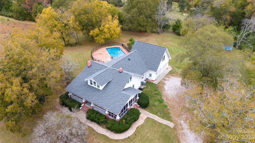 Back on Market due to no fault of the Seller!  Welcome to this cozy Farmhouse on almost 2 acres.  Enjoy Fall on the wrap around front porch or side screened porch.  Then in Spring and Summer hang out by the private back yard inground pool with new concrete surrounding.  High ceilings and spacious rooms.  The den has knotty pine paneling, built-in cabinets and a wood burning fireplace.  Large primary bedroom with private ensuite.  Main level bath has been newly remodeled.  Enjoy the large county kitchen with many cabinets.  There is an extra space to use as another bedroom or bonus room.  Owner had the roof replaced three years ago.   There is a newer Gas Stove Installed and a newer Tankless Water Heater.  New Pool Liner and Pump replaced.  HVAC was replaced last year.  The Garage Doors were just replaced.  So many new improvements for this SC seemingly Plantation home!