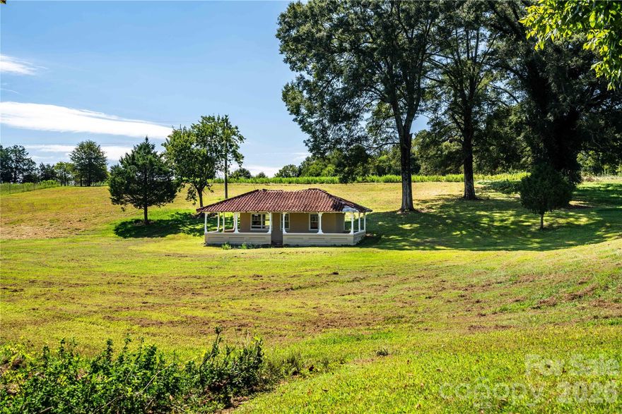 Welcome to a property where history, nature, and possibility come together. Set on 18.78 acres in Newton, NC, this distinctive estate comes with a remarkable donation—a 66.10-acre wildlife conservancy to preserve and enjoy for years to come. Stroll beneath the canopy of mature trees and you’ll find a welcoming 2-bedroom log cabin, a picturesque dairy barn, quaint caretaker’s quarters, a nostalgic ice cream parlor, and a charming log chapel adorned with stained glass. A peaceful pond mirrors the changing seasons, while the versatile party venue sets the stage for gatherings of any size. Whether your vision is a storybook wedding venue, a hobby farm, or a private retreat, this property offers the perfect blend of charm, space, and opportunity.