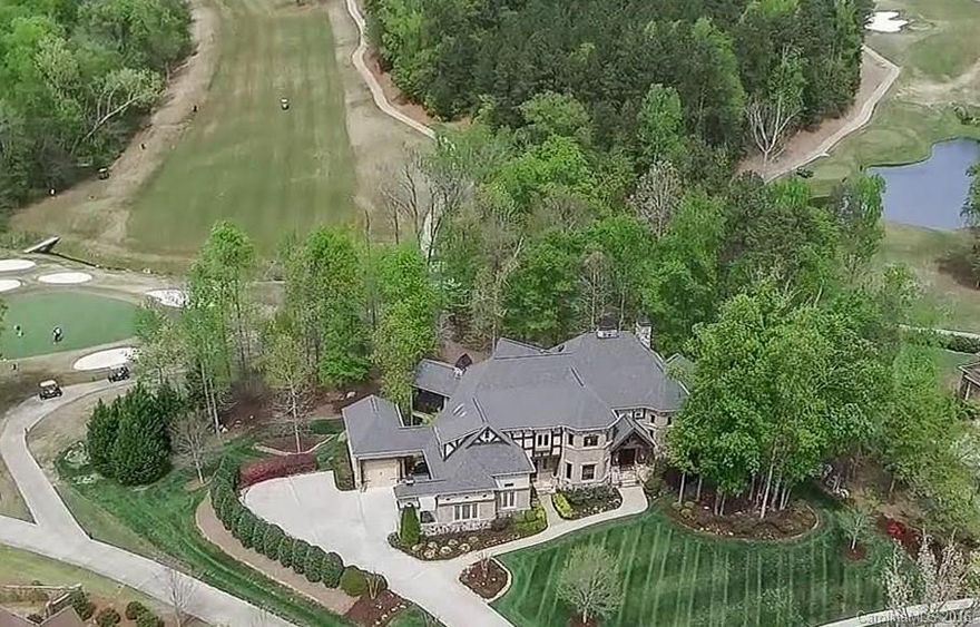 One-of-a-kind Manor w/High Quality Craftsmanship, Beautiful Landscape & Luxurious Appointmts thruout. Grand Entry w/35' See-thru Stone FP to Great Rm +4 Addl Handcrafted FPs, Stunning Floating Staircase, Elevator, Turrets/Domed/Coffered/High Ceilings, Gourmet Kit, Hearth Rm, Main Mstr Ste. Over 1500 sf on 4 Terraces, Scrn Prch w/Stone FP. Golf/Water/Greenway Views. Lower Level Dream Entertain/Living Area, Kit/Bar, Grt Rm, Theater, Wine, Fitness, BR/BA, Amazing Workshop. Irrig Well. Low SC taxes.