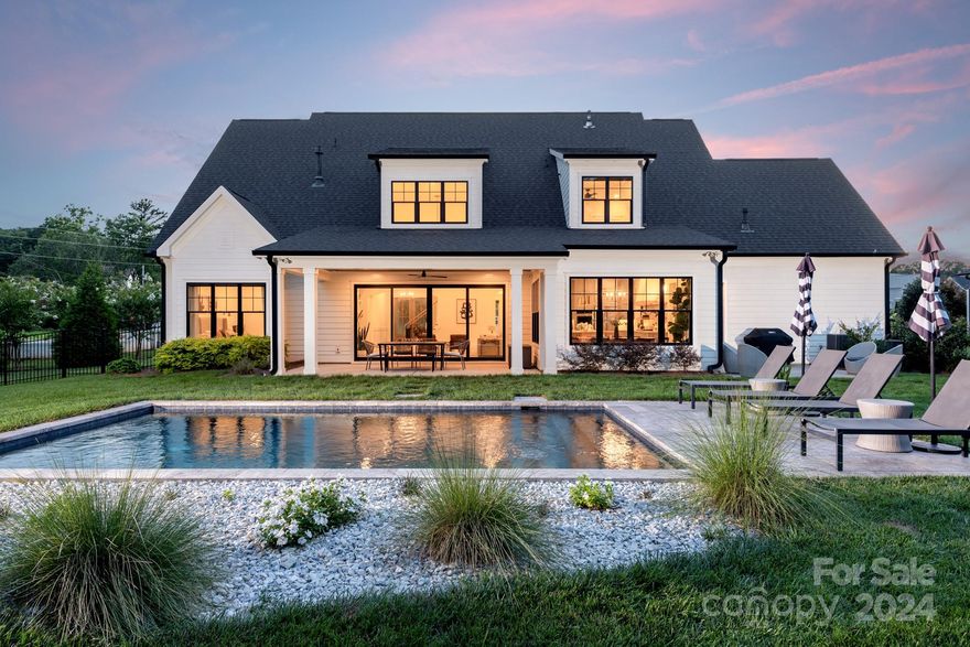 *Multiple offers received, best and final due by 12 noon on 8/27. *Welcome home to this incredible Linnane Homes custom modern farmhouse. Prepare to be wowed by the stylish finishes, soaring vaulted ceilings, abundant natural light, and functional open floor plan, blending indoor and outdoor spaces with ease. Owner's suite on main level as well as an additional bedroom and en-suite bathroom, offering excellent flexibility of use. Your dream kitchen awaits, boasting both a walk in pantry and chic bar area with access to the grilling patio. Upstairs offers a large bonus room with connected office/flex space, 3 bedrooms and 2 full baths. Enjoy resort-like outdoor living in the fenced half-acre yard with saltwater plunge pool, fire pit, and beautiful landscaping, all backing to a protected wooded area for excellent privacy. Located just 10 minutes or less from Birkdale Village and LKN, Hollins Grove is a quiet upscale neighborhood with ele. and middle schools just a 5 minute drive away.