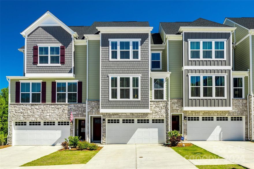 Welcome to this beautiful Tega Cay townhouse with lots of upgrades. This 3 story home offers the convenience of a 2 car garage & 1st level guest suite w/ a full bath. Go upstairs to find the main living space w/ an all white kitchen w/ quartz countertops, herringbone tile backsplash, gas oven & range, & large island. All of which is completely open to the large living room, dining area, & screened-in balcony equipped w/ a gas fireplace & TV perfect for a relaxing evening. The light color LVP flooring throughout the living area pairs perfectly w/ natural light streaming in. On the top floor, you'll find the primary bedroom w/ ensuite consisting of an oversized walk-in shower & double vanities. 2 more bedrooms, a 3rd full bathroom, & the laundry is also on the third level. Close to the Tega Cay Country Club, Lake Wylie, schools, retail, restaurants, & easy access to I-77 w/ a very quick commute to Charlotte, NC. 3D tour available at https://my.matterport.com/show/?m=9aYrfQXtQzo