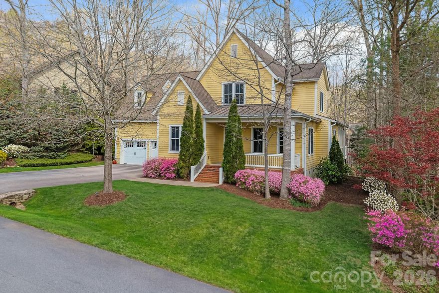 Welcome to 25 East Owl Creek Lane, an exceptional home located in the heart of Southcliff—one of Western North Carolina’s most desirable gated communities. Designed for those who value privacy, quality, and connection to nature, this meticulously maintained 5-bedroom, 4.5-bathroom residence offers luxury living just minutes from Downtown Asheville and the Blue Ridge Parkway. Set on a majestic, tree-lined street that ends in a cul-de-sac, this property offers a uniquely private and peaceful setting. A charming covered front porch invites you in, with mountain views from the front yard and a serene natural backdrop. Step through the grand foyer into an expansive, open-concept living space filled with custom details—gleaming hardwood floors, 8-foot doors, and luxury crown molding throughout. The great room, centered around a cozy stone fireplace, flows effortlessly into the upscale chef’s kitchen featuring upgraded appliances, gorgeous cabinetry, striking countertops, and a large island with a raised breakfast bar. The oversized primary suite is conveniently located on the main level and features tray ceilings, dual walk-in closets, and a luxurious en suite bath complete with dual vanities, a tiled walk-in shower, and a jacuzzi soaking tub—perfect for unwinding at the end of the day. Step out onto the large covered back deck to enjoy a private, wooded setting—ideal for morning coffee, evening dinners, or quiet relaxation year-round. As a resident of Southcliff, you’ll enjoy access to over six miles of private hiking trails, scenic parks, playgrounds, community fire pits, and a covered pavilion. This thoughtfully planned community offers the best of both worlds: tranquil mountain living with easy access to the culture, dining, and the charm of Asheville.