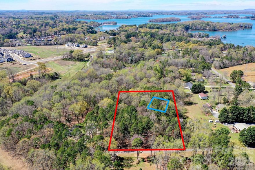 Rare Opportunity to build on 2.4 acre lot(2 1+ acres lots combined) Parcel ID 00901118 and 00901141, in Prime Huntersville Location! This beautiful 2.4-acre wooded homesite offers the perfect blend of privacy and convenience—just minutes from Birkdale Village and Interstate 77
Enjoy a serene, natural setting with no HOA restrictions and a private road, giving you the flexibility to build your dream home exactly how you envision. A previous home site was thoughtfully considered in 2021, and survey ties remain in place marking both lots, making it easier to plan your build.

The property has been marked with blue tape to illustrate a potential homesite—ideally situated to maximize privacy while still offering ample space for outdoor living, including a future pool, garden, or expanded entertaining area. As survey and perk test were completed in 2021. Natural Gas line does run through the lots, cleared section is the gas line  area. See Survey for Gas Lines and set backs.  

Whether you’re looking to build now or invest for the future, this property provides space, privacy, and location—a rare combination in today’s market.